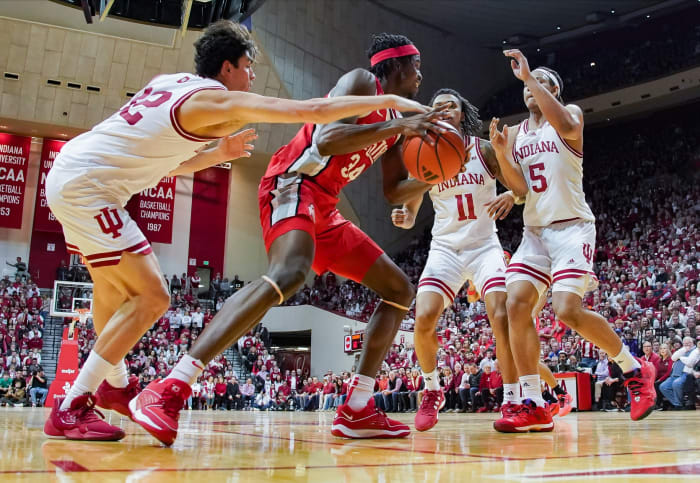 Indiana Hoosiers guard Trey Galloway (32) knocks the ball away from Ohio State Buckeyes center Felix Okpara (34) during the second half at Simon Skjodt Assembly Hall.